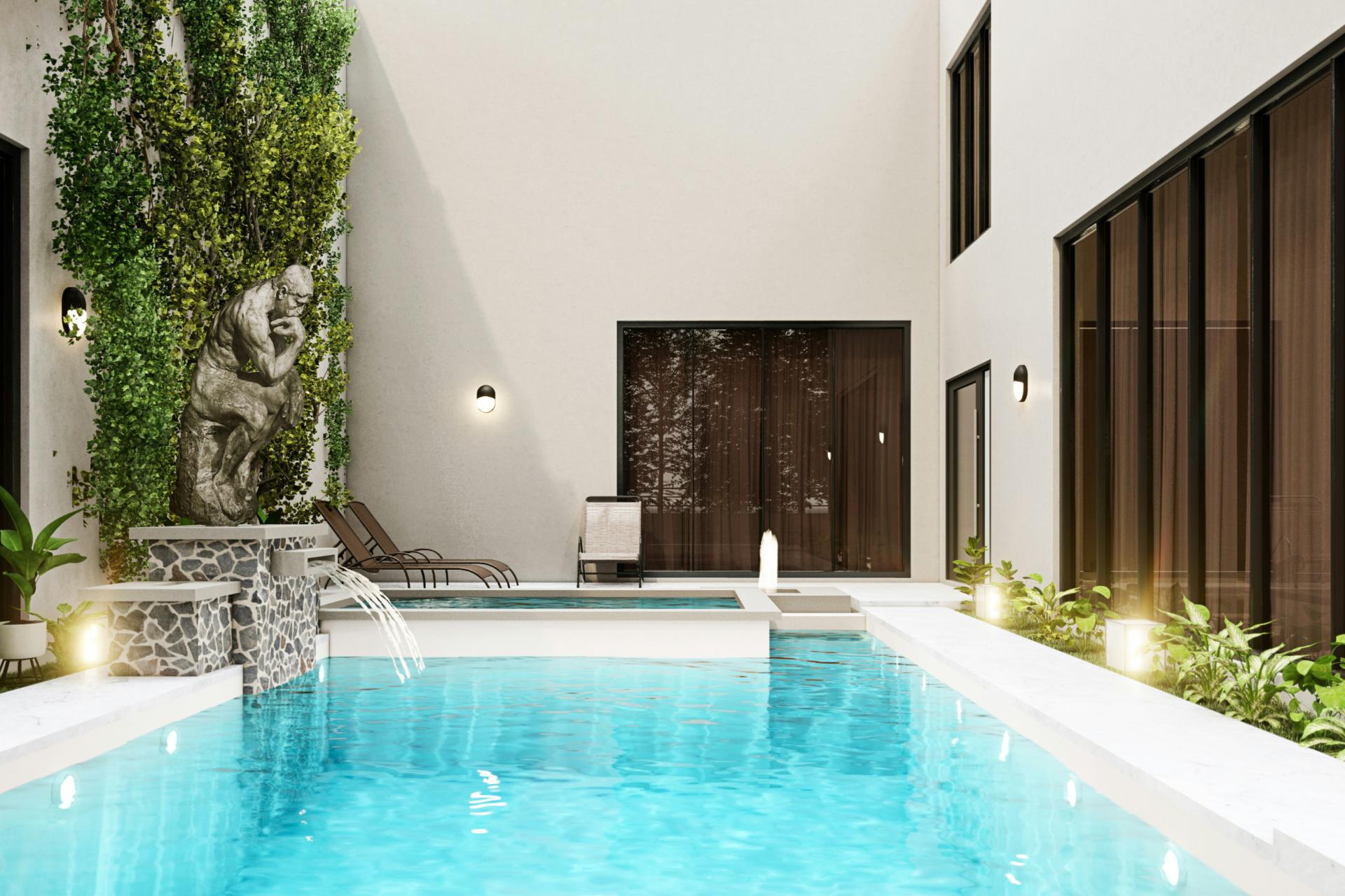 Piscina grande al lado de un edificio blanco